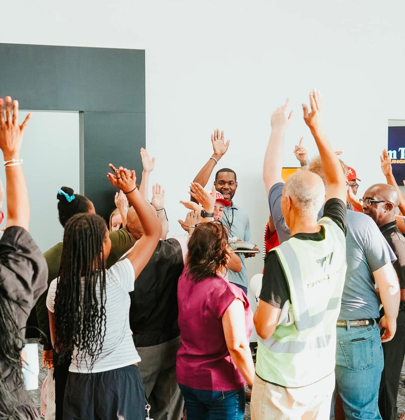church community with hands in the air