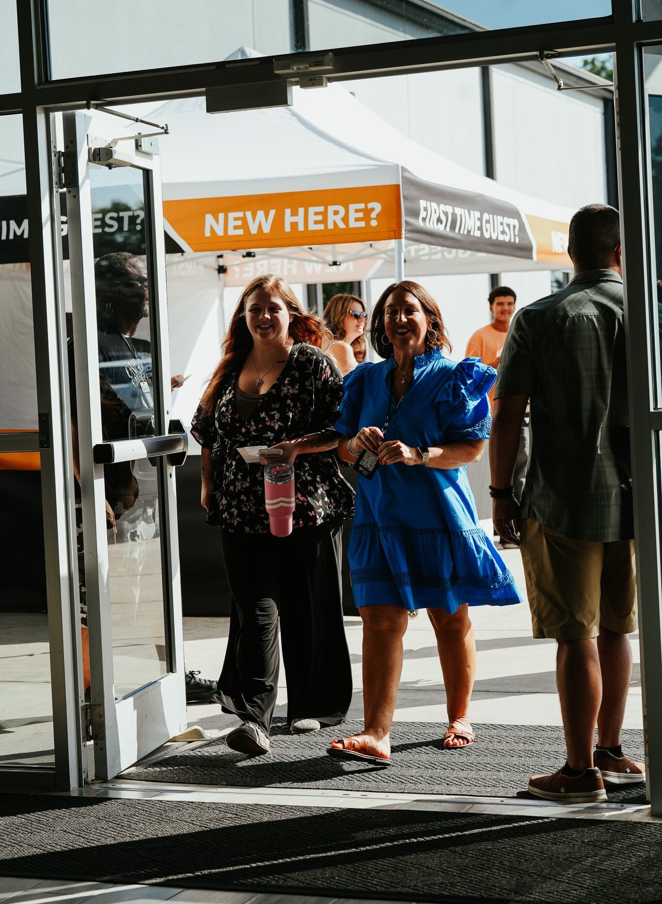 2 women walking in the doors of McDonough church for their first visit